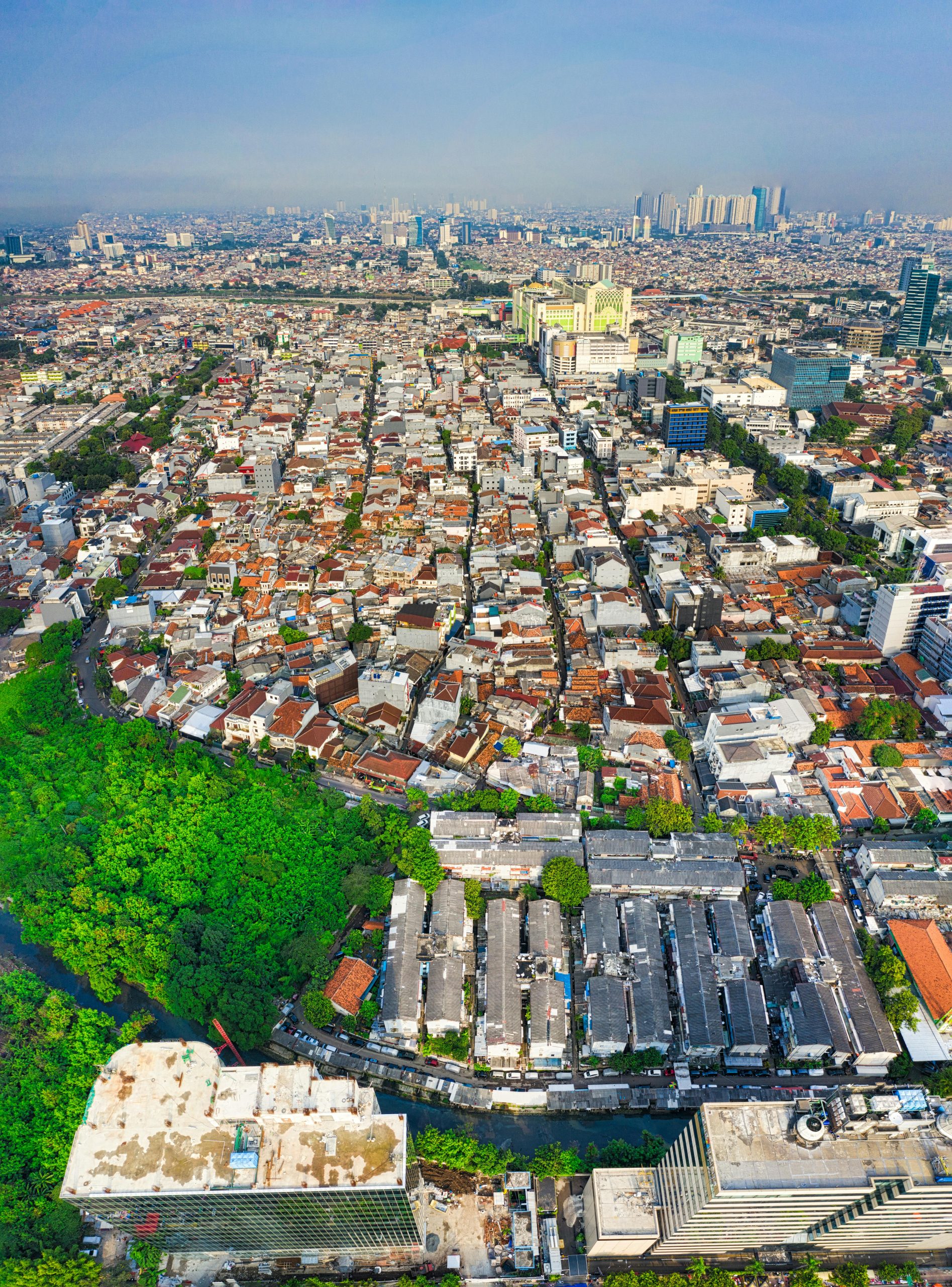 Stunning aerial view of Jakarta's dense urban sprawl and skyline on a clear day.